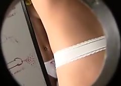 Bootylicious blonde in whote thong plays with glory hole dick