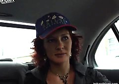 Red-haired mature nymph masturbates in a taxi